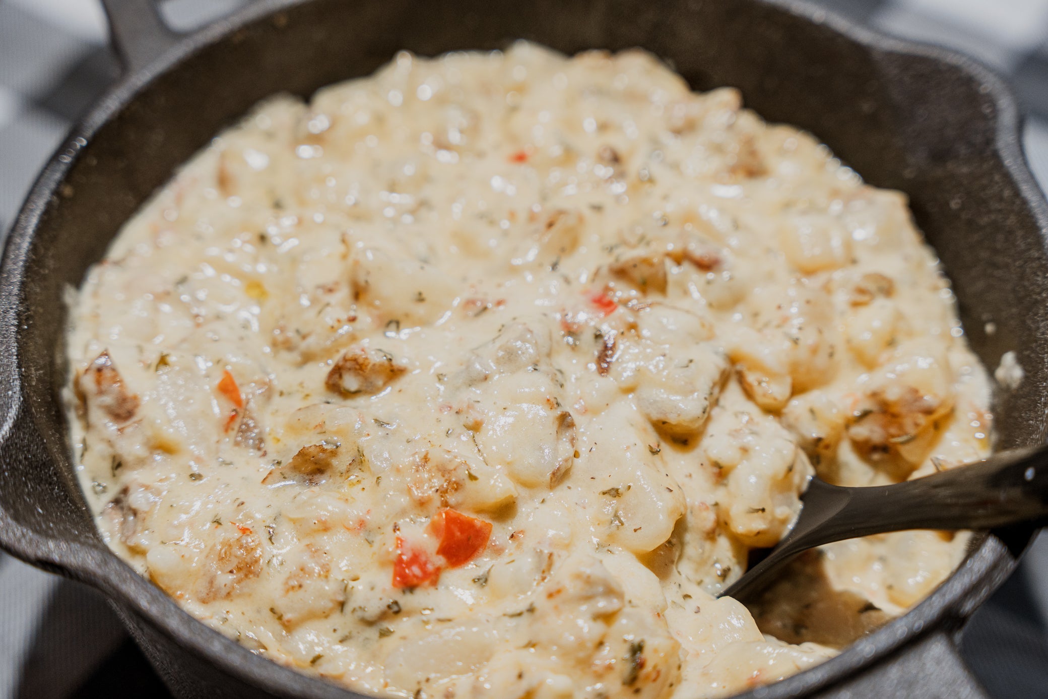 Slap's popular warm baked potato casserole being mixed
